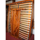 A contemporary cherry wood super kingsize bedstead, having twin side rails and fitted slatted base