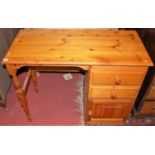 A modern pine kneehole single pedestal child's desk, width 94cm