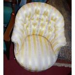 A mid-Victorian mahogany framed and floral striped silk damask button back upholstered tub armchair