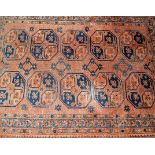 A Persian woollen brown ground Bokhara rug having flat weave kilim ends, 145x102cm