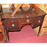 An early 20th century mahogany bowfront three drawer kneehole dressing table, width 91cm