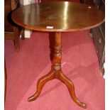 A George III mahogany circular tilt-top pedestal tripod occasional table, dia.57.5cm