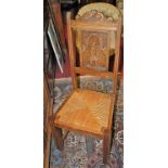 A set of six circa 1900 Belgian oak carved figural panel back dining chairs, having drop-in rush