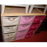 A pair of laminate childs sectional storage chests, each with 12 pull-out baskets, width 102cm