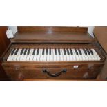 An oak cased travelling piano, having iron carry handle, w.74cm