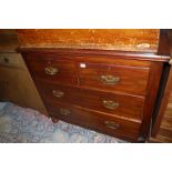 An Edwardian stained pine chest of two short over two long drawers on bun supports, width 100cm