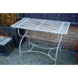 A contemporary galvanised metal slatted rectangular garden table, width 102cm