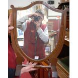 A mahogany and satinwood strung shield shaped swing dressing table mirror