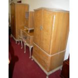 A 1930s Maple & Co figured walnut and crossbanded bedroom suite, comprising double door wardrobe,
