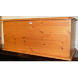 A modern pine hinge top toy box, width 84.5cm