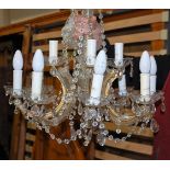 A brass and cut crystal glass hanging twelve light hanging electrolier