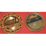 A floral gilt plaster circular convex wall mirror; together with a gilded circular wall mirror (2)