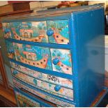 A child's blue painted two piece bedroom suite comprising; ledgeback compactum and a ledgeback