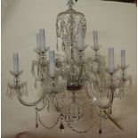 A pair of cut glass twelve-light electrolier, each having a central urn column supporting two rows
