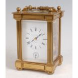 A Matthew Norman lacquered brass carriage clock with alarm, having a swing carry handle over visible
