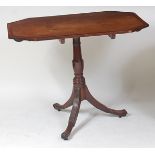 A Regency mahogany and crossbanded pedestal tripod table, having octagonal tilt-top to a gun