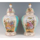 A pair of late 19th century Dresden porcelain vases and covers, each panel decorated with