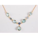 An aquamarine and sapphire necklace, the four oval spectacle set aquamarines, approx. 10-11mm
