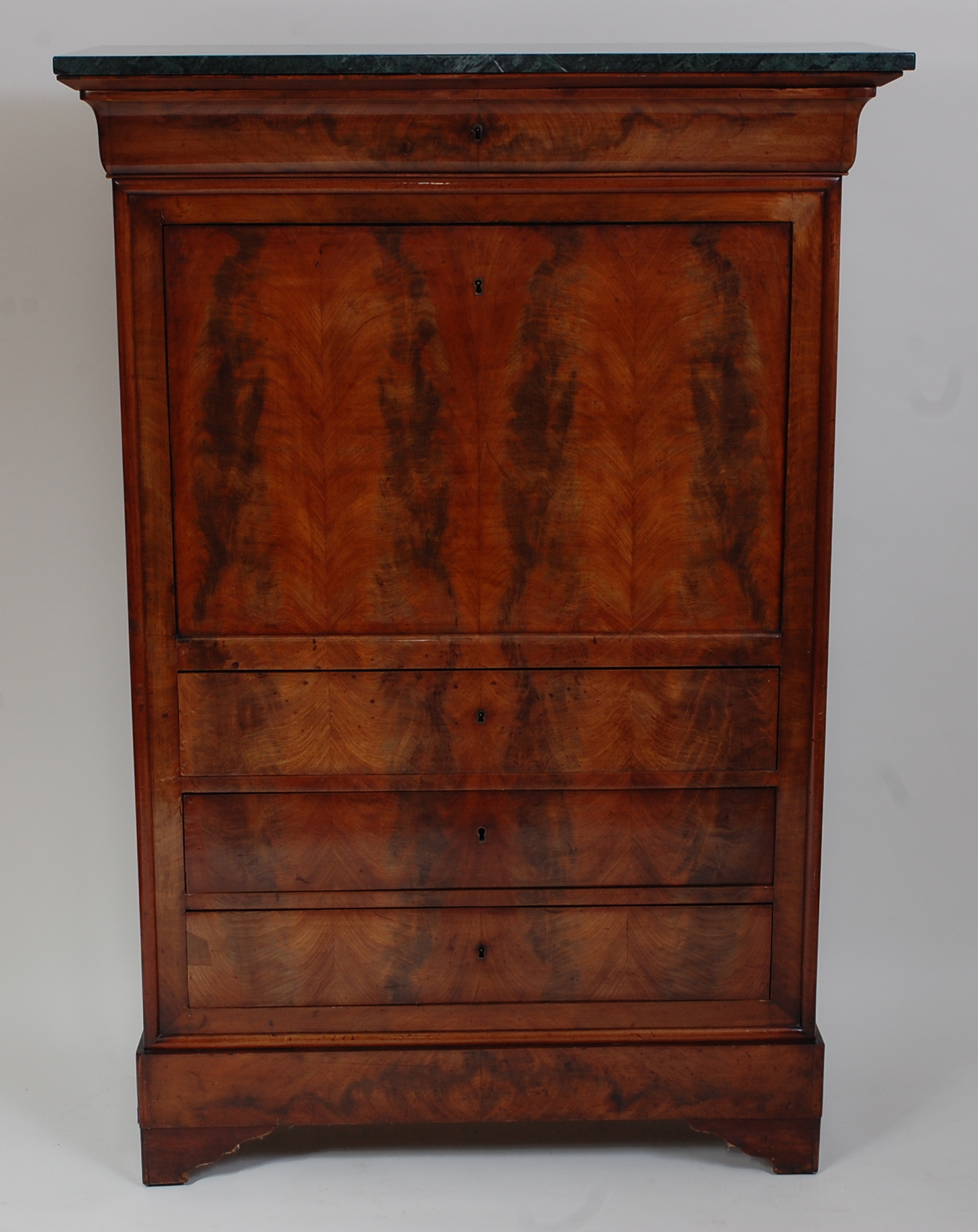 *A 19th century mahogany escritoire, having a green veined marble top above a frieze drawer, with