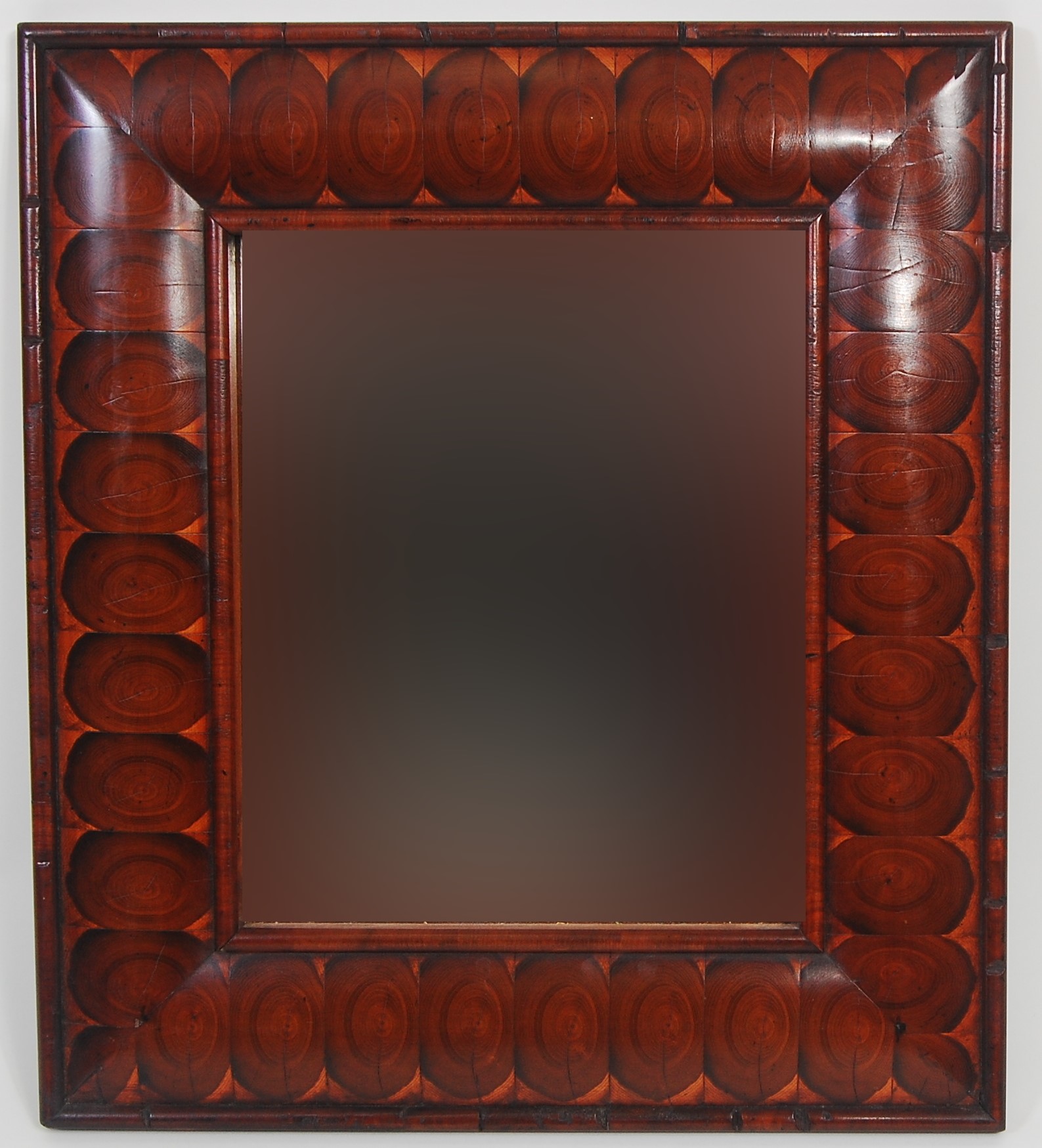 An oyster veneered cushion framed wall mirror in the William & Mary style, 60 x 53cm