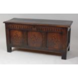 An early 18th century joined oak three-panel coffer, the top having a moulded edge and on
