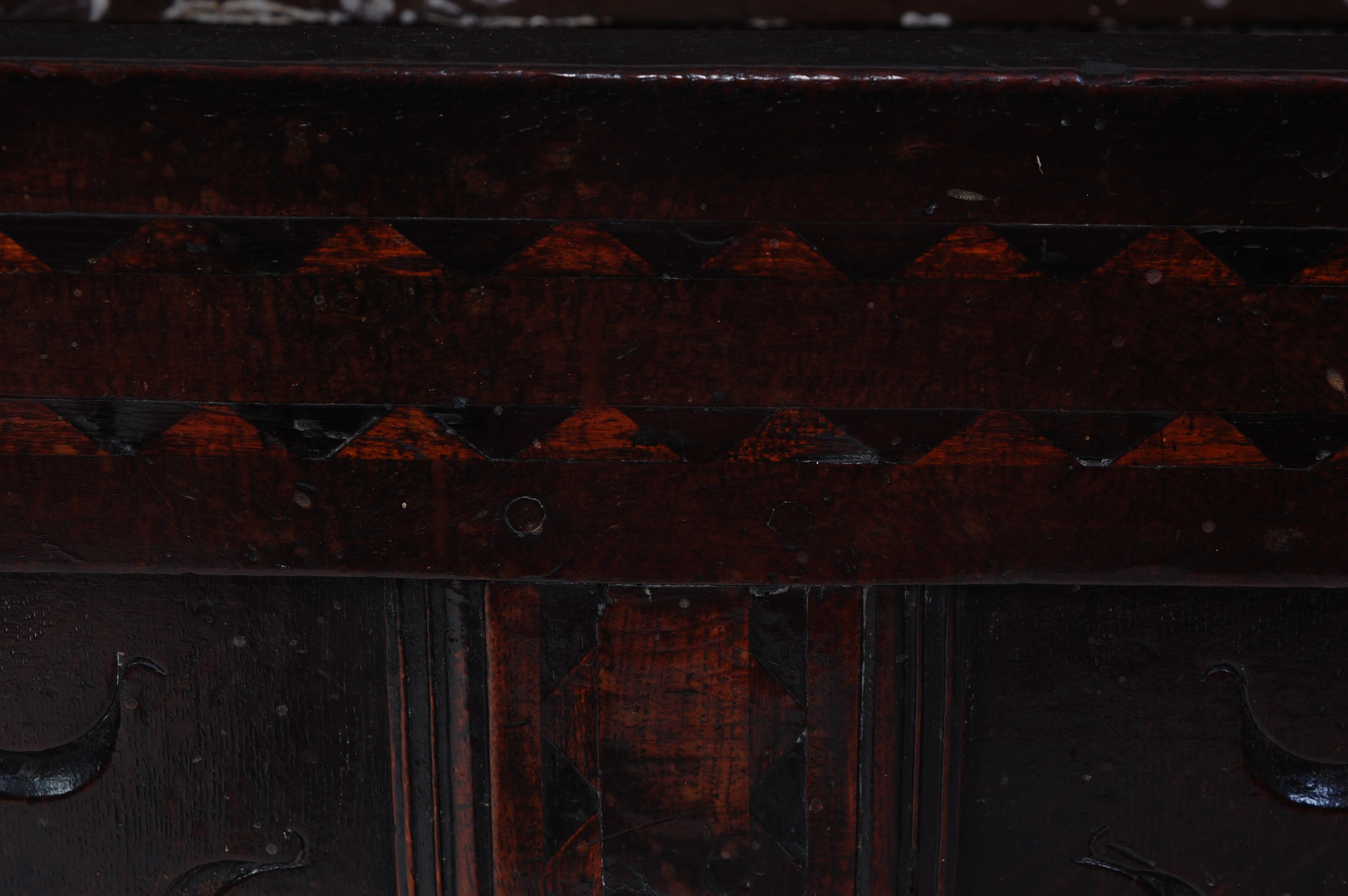 *An 18th century joined oak coffer, the two-plank top on split ring hinges, above a carved three - Image 5 of 6