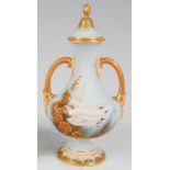 *A Royal Worcester twin handled vase and cover, on a turquoise ground, enamel decorated with swans