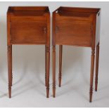 A pair of George III style mahogany and boxwood strung bedside night tables, each having a tray-