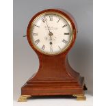 A mid-Victorian fiddleback mahogany balloon cased mantel clock, the convex dial signed J&A Jump