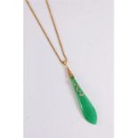 A jade and diamond pendant, the elongated teardrop pear shaped pendant, with a single undulating