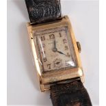 A gentleman's 1930's 9ct Rolex wristwatch, the rectangular signed face with gilt Arabic numerals,