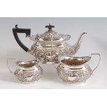 A late Victorian silver three-piece tea set , comprising teapot, twin handled sugar and cream,