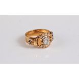 An 18ct diamond buckle ring, the principal round brilliant cut diamond, estimated approx. 0.33cts,