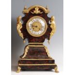A circa 1800 French faux tortoiseshell and gilt metal mantel clock, the balloon shaped case with