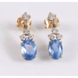 A pair of 18ct sapphire and diamond earrings, the oval cornflower blue sapphires, approx. 9mm