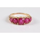 A five stone ruby ring, the five graduated cushion cut rubies, between approx. 4.1 - 5.8mm wide, set