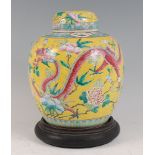 A Chinese export yellow ground ginger jar and cover, the whole enamel decorated with four-claw