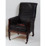 A William IV mahogany library armchair, the whole upholstered in a chocolate brown leather, having