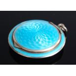 A small sterling silver and light blue guilloche enamelled lady's compact, of circular form, the