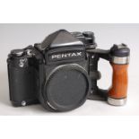 An Asahi Pentax 6x7 medium format SLR camera, No.4092506; together with a Takemar 4/135 Asahi Pentax