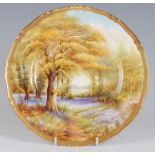 *A Royal Worcester porcelain cabinet plate, hand-painted with bluebells in Kew Gardens by Raymond