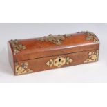 A Victorian figured walnut and brass mounted needlework box, the hinged cover opening to reveal silk