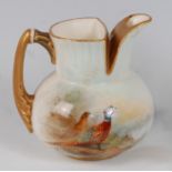 *A Royal Worcester porcelain jug, of squat globular form, with gilt spout and handle, hand-painted