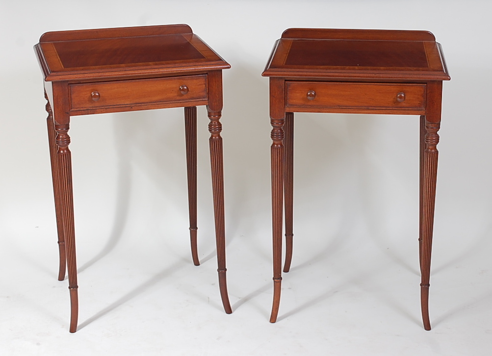 A pair of Regency style mahogany lamp tables, each with crossbanding and single frieze drawers, w.