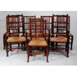A set of eight Lancashire elm spindleback chairs, each having replacement rush seats, turned
