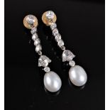 A pair of diamond and 'pearl' earrings, the collet mounted round old cut diamond, suspending four