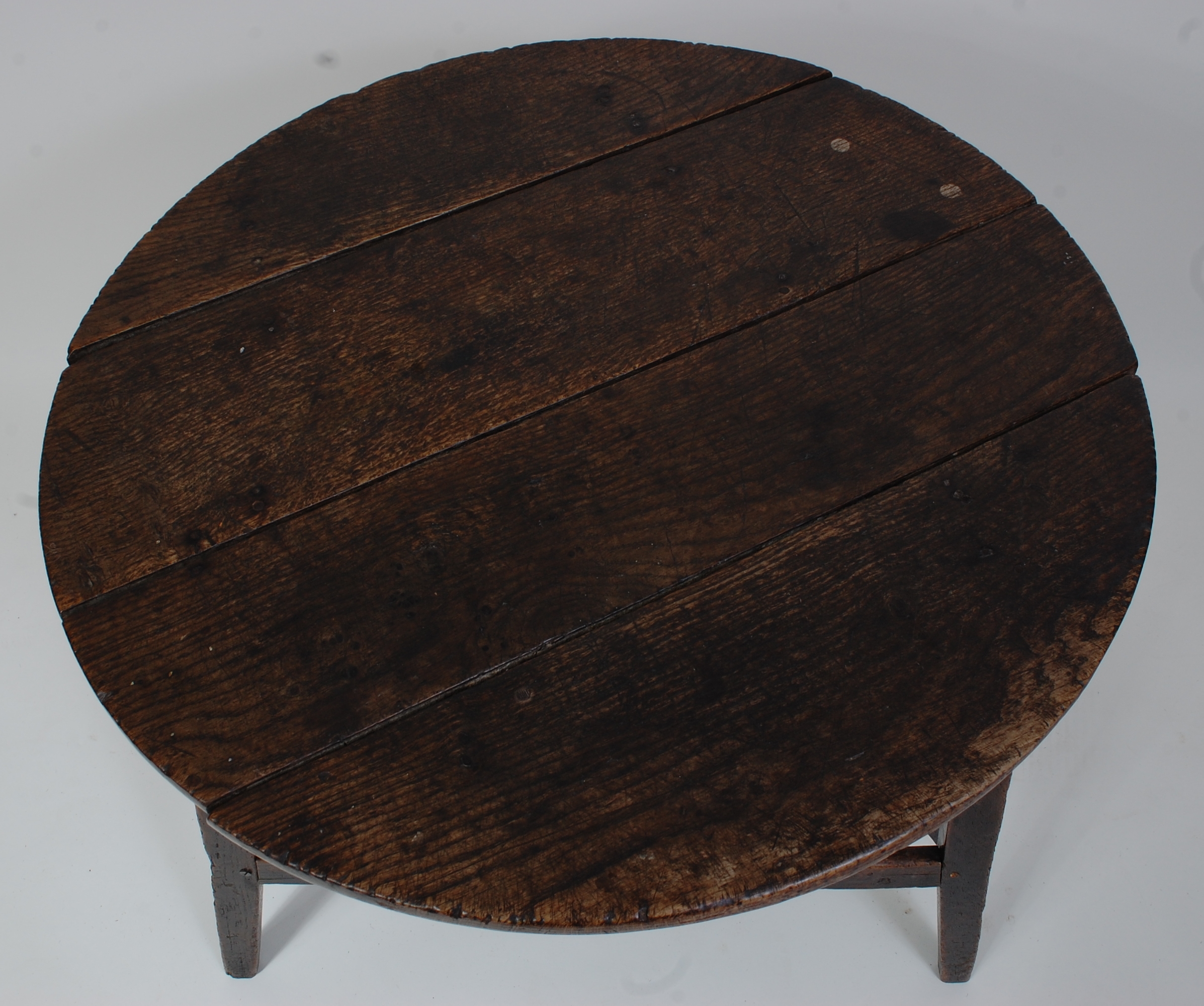 An 18th century oak cricket table, the circular four-plank top above a plain frieze, on typical base - Image 2 of 3