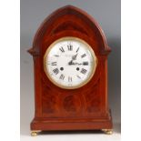 A circa 1900 mahogany and inlaid bracket clock, having a lancet top, the convex white enamelled dial