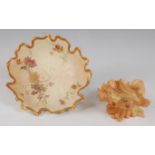 *A Royal Worcester porcelain blush ivory lotus leaf bowl, having a gilt edge, painted with floral