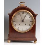 An Edwardian mahogany dome-top mantel clock, having an unsigned silvered convex dial, twin winding